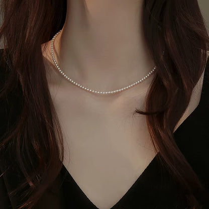 Classic Grace – Round Shell Pearl Necklace